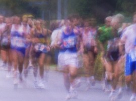 Marathon runners on road (blurred motion)